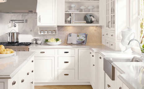Kitchen with white cabinets, grey countertops, and decor